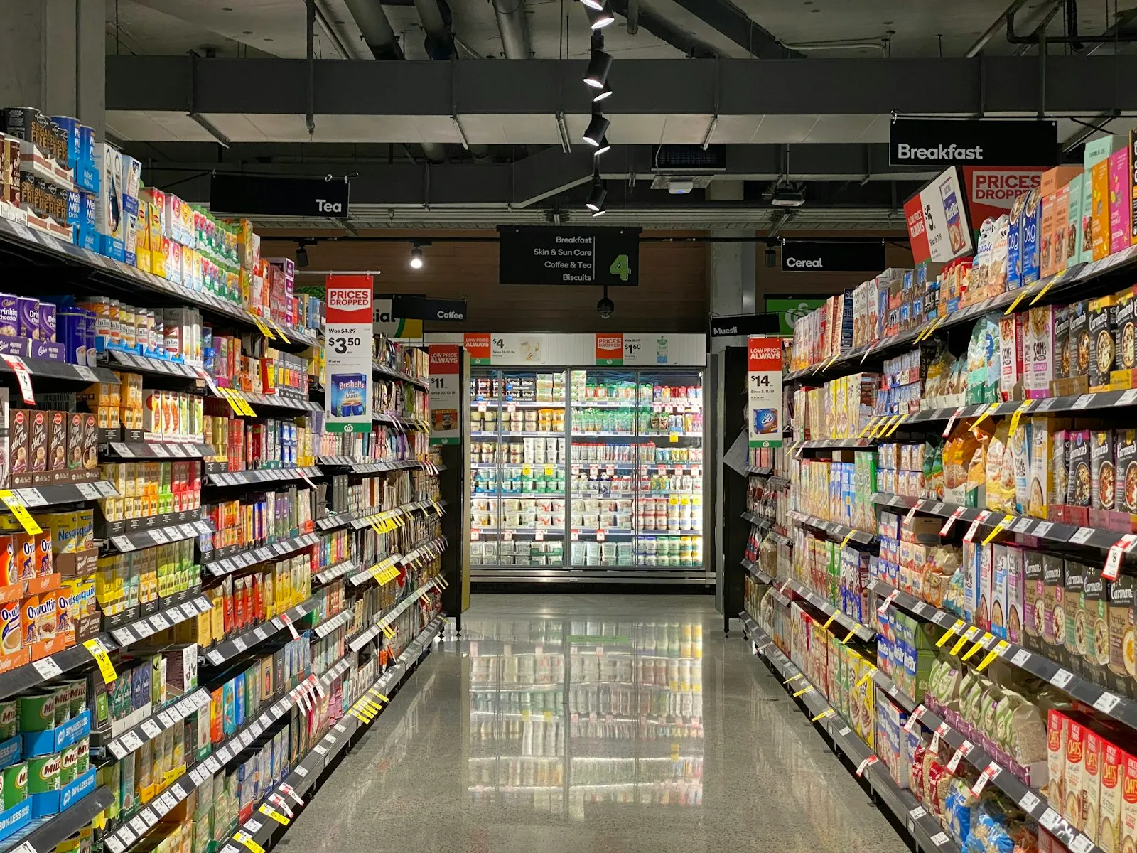 Convenience store aisle stocked with grocery products