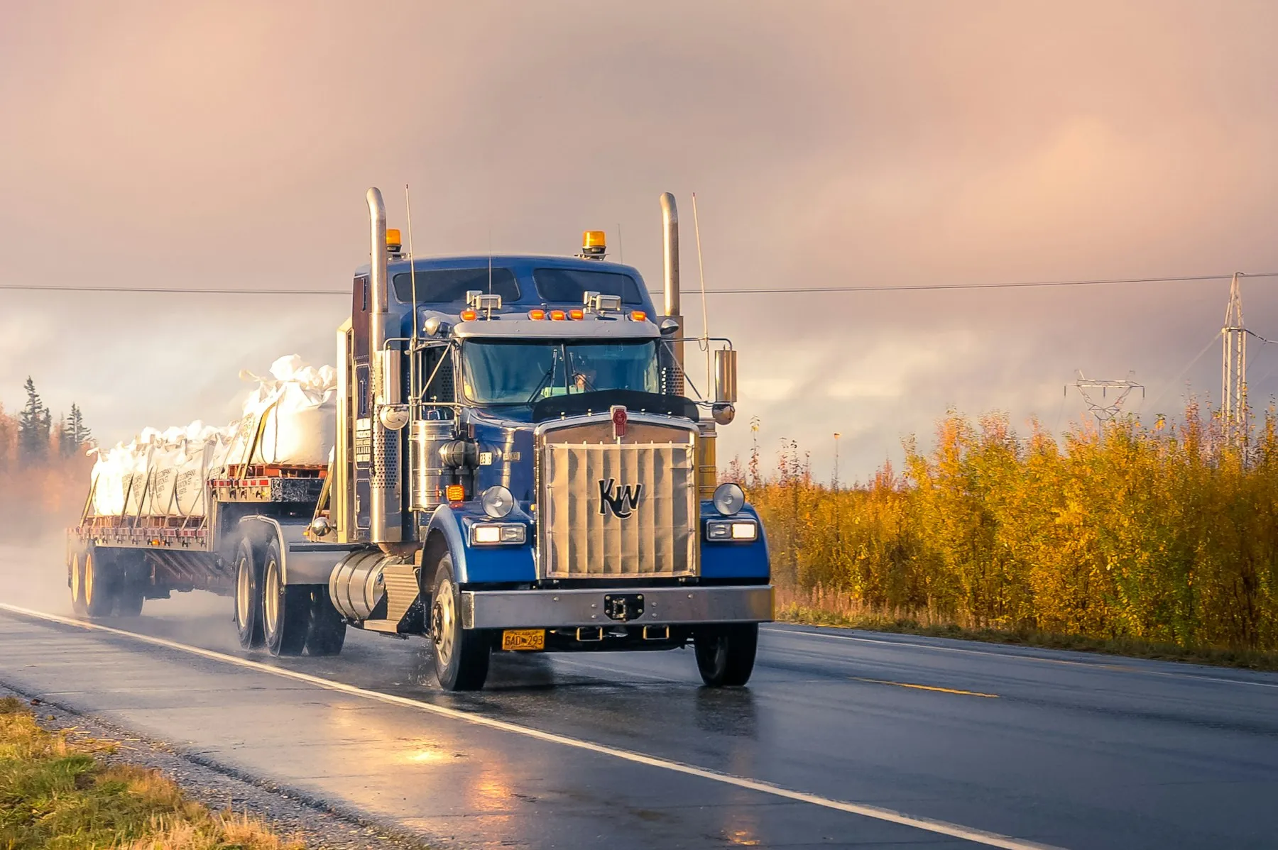 Distribution truck on a Texas highway at dawn